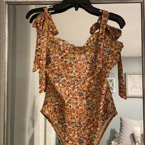 Floral bodysuit with tie sleeves and ruffle edge